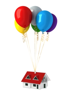 Group of multicolor balloons, lifting up a house.